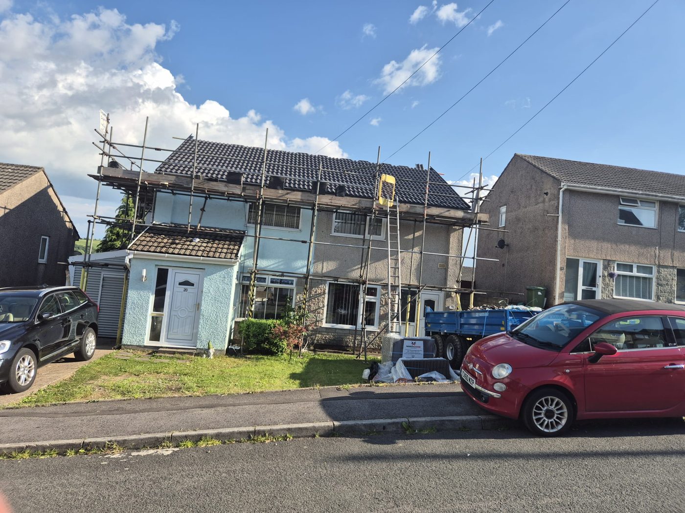 Finished black tile semi with scaffolding