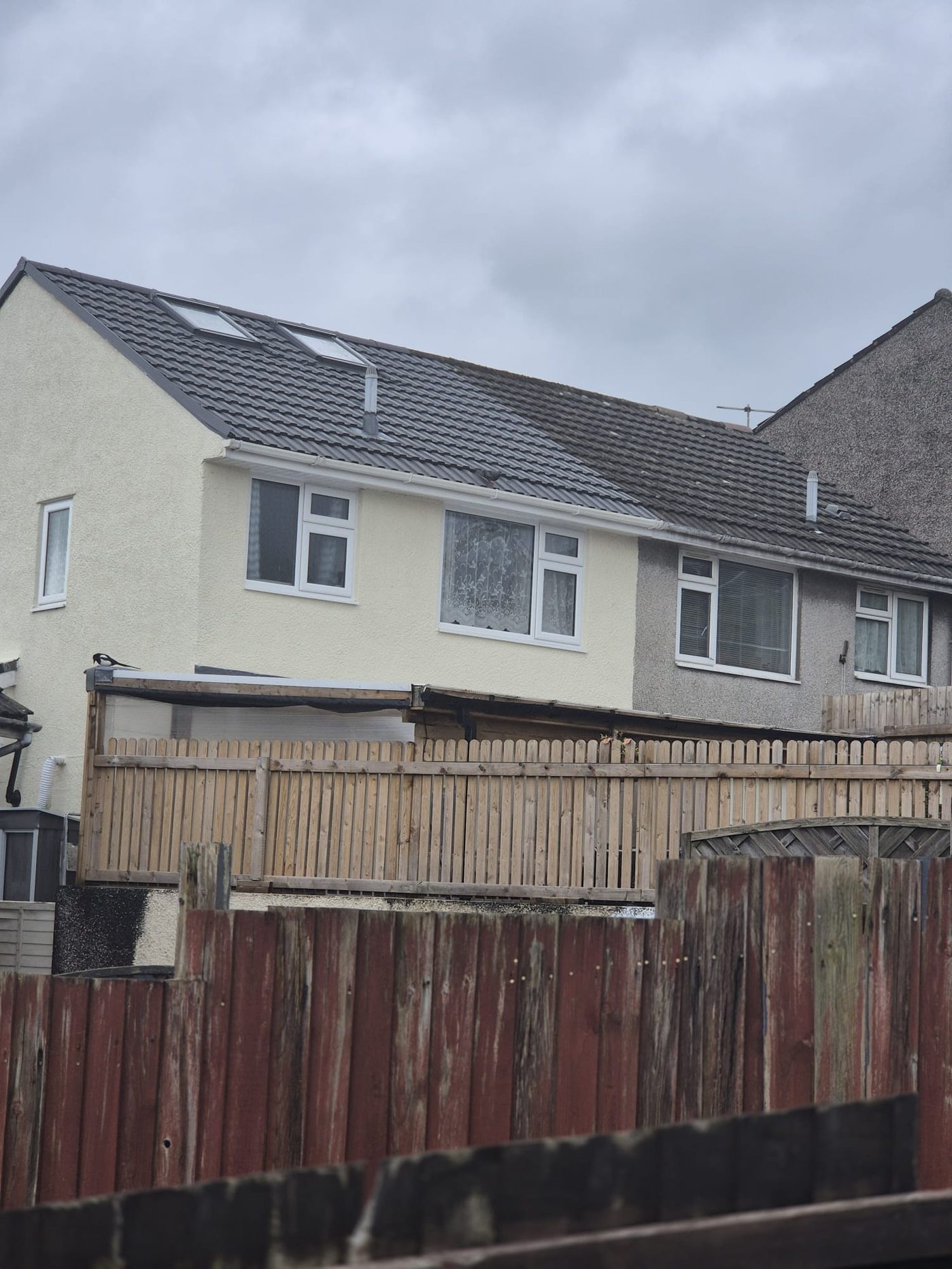 Finished black tile roof with dormer